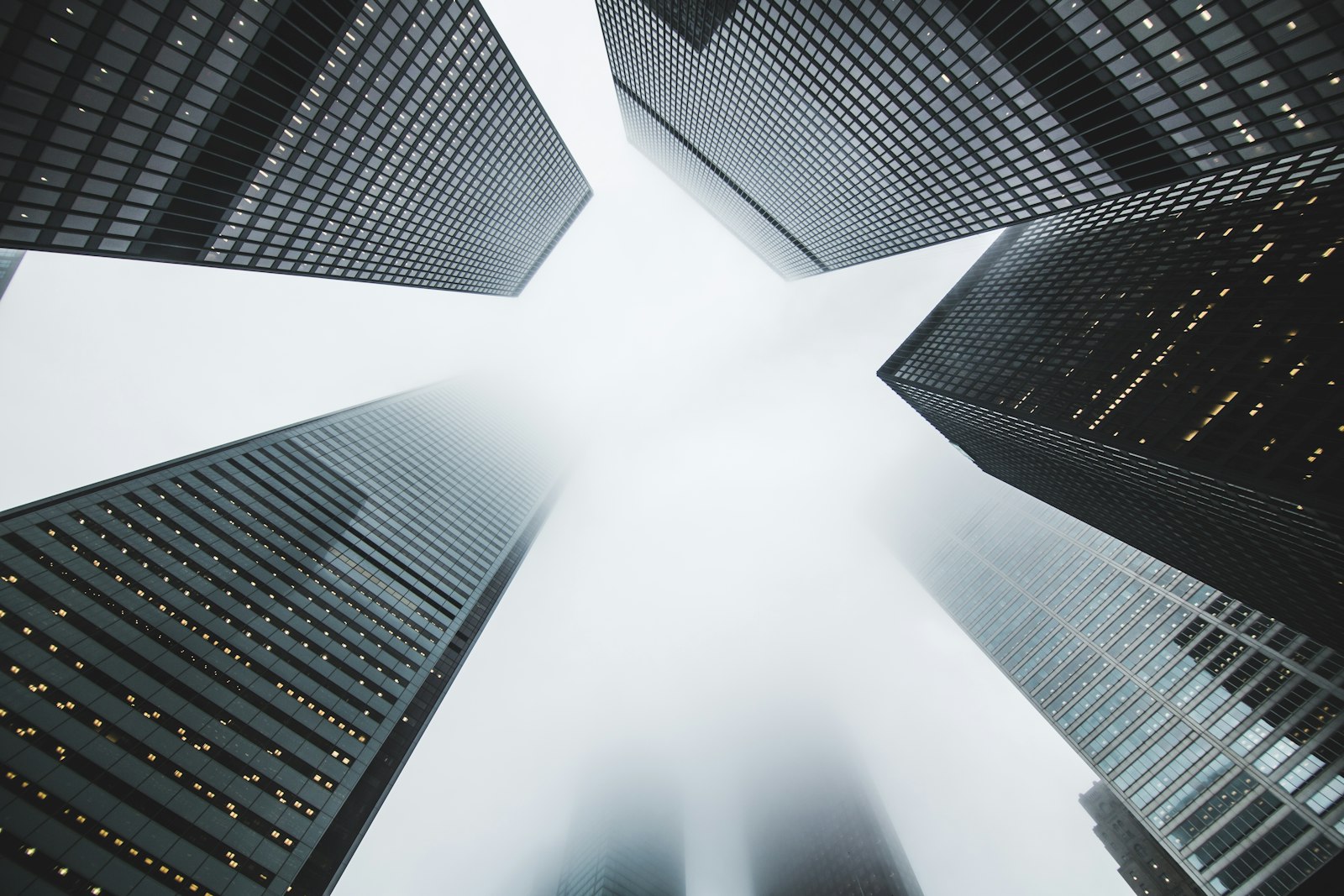 Office towers rising into fog